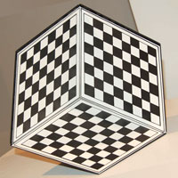 The Slu Cube: three checkered panels joined into an inside corner reading as a floating cube